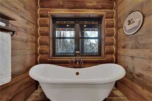 Bathroom with wood walls