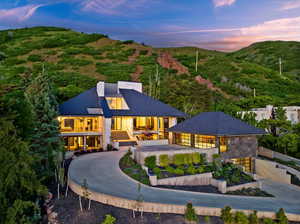 House at dusk featuring a mountain view