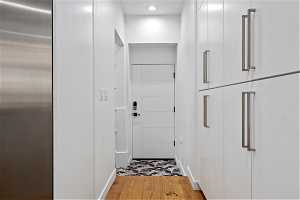 Doorway to outside featuring light hardwood / wood-style flooring