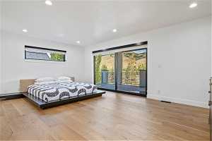 Bedroom featuring access to outside and light hardwood / wood-style flooring