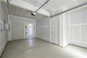 PRIVATE garage with a garage door opener and EV outlet
