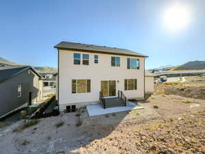 Rear view of property with a mountain view