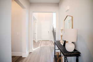 Entrance foyer with light hardwood / wood-style floors