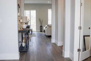 Corridor featuring dark hardwood / wood-style floors