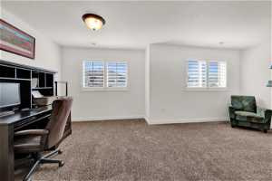 Large bedroom used as office space featuring plenty of natural light, kids play area, and walk-in closet.