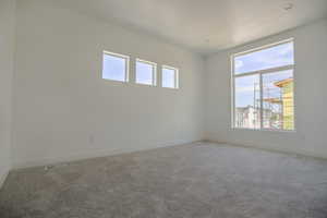 Spare room with light colored carpet