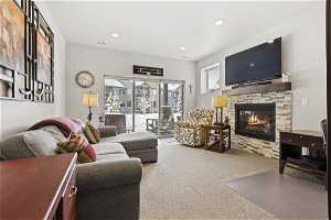 Carpeted family room with a fireplace