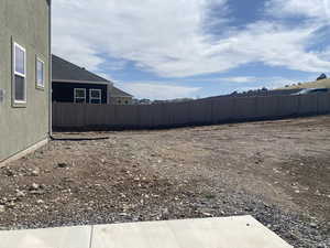 View of yard with fence