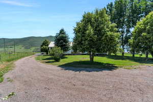 View of street with a mountain view and a rural view