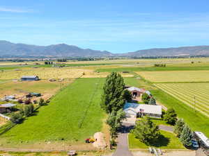 Birds eye view of property featuring a rural view and a mountain view