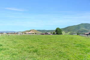 Property view of mountains with a rural view