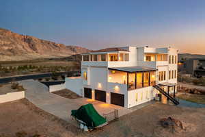 View of front facade featuring a patio and a mountain view