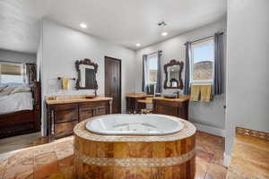 Bathroom featuring tile flooring and large vanity