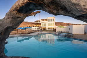 View of swimming pool featuring a patio area and a mountain view