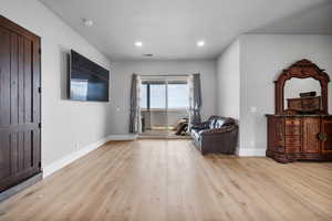 Sitting room featuring light hardwood / wood-style flooring