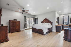 Bedroom featuring light hardwood / wood-style flooring, access to outside, and ceiling fan