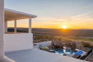 Exterior space featuring a fenced in pool and pool water feature