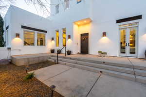 Doorway to property featuring french doors and a patio