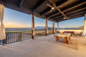 Patio terrace at dusk with a mountain view