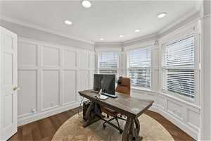 Office/bedroom featuring crown molding and dark hardwood / wood-style floors
