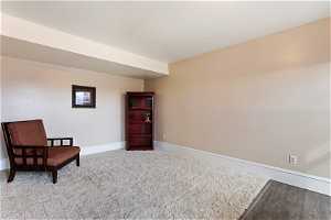 Sitting room with light hardwood / wood-style floors
