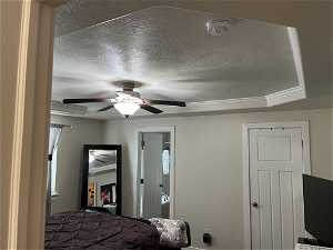 COFFERED CEILING AND CEILING FAN IN MASTER BEDROOM.