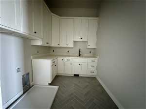 Laundry area with sink
