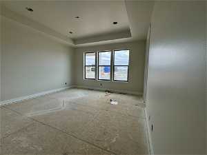 Spare room with a tray ceiling