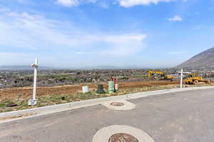 Exterior space with curbs and a mountain view
