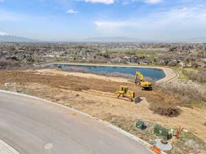 Birds eye view of property featuring a water and mountain view