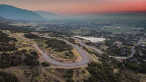 Aerial view at dusk with a water and mountain view