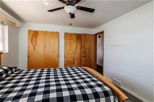 2nd bedroom featuring multiple closets and ceiling fan