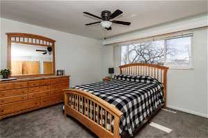 Second bedroom featuring ceiling fan