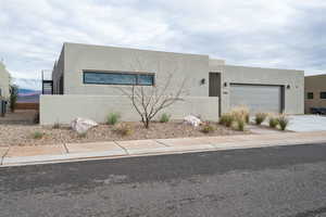 Southwest-style home with a garage