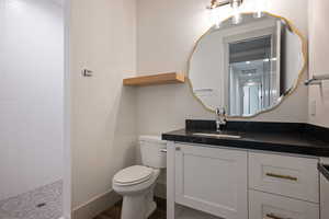 Bathroom featuring vanity and toilet