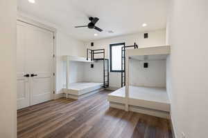 Unfurnished bedroom with a closet, light hardwood / wood-style floors, and ceiling fan