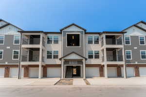 View of property featuring a garage