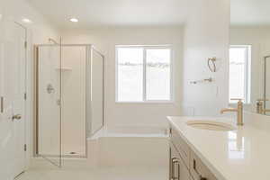 Bathroom with vanity, separate shower and tub, tile patterned flooring, and plenty of natural light