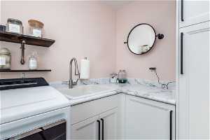 Laundry area with sink and cabinets