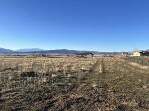 Property view of mountains with a rural view