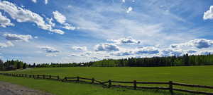 Exterior space featuring a rural view and a lawn