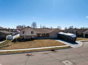 View of front of property with a front yard