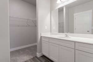 Bathroom featuring vanity and hardwood / wood-style floors