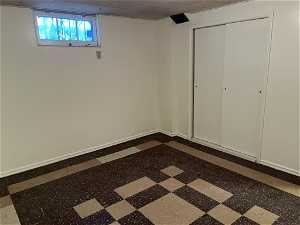 Basement featuring a paneled ceiling