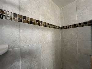 Details with a tile shower