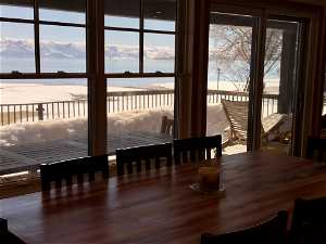Dining area with hardwood / wood-style flooring and a mountain view