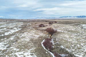 Snowy aerial view with a mountain view