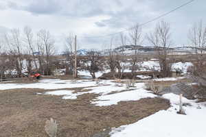 View of yard covered in snow