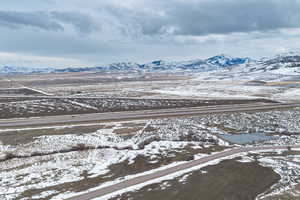 Snowy aerial view featuring a mountain view