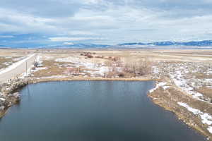 Aerial view featuring a water and mountain view